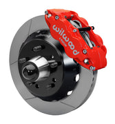 Wilwood front red Superlite 6R caliper beside a 13.06-inch slotted rotor, angled assembly for CPP truck 13.06-inch brake setup