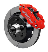 Wilwood front red Superlite 6R caliper beside a 14.00-inch slotted rotor, angled assembly for CPP truck 14-inch brake setup