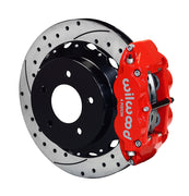 Wilwood Red Superlite Rear Brake Kit for Corvette C4, angled red caliper and drilled/slotted rotor assembly