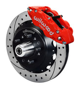 Wilwood front Forged Narrow Superlite 6R kit for GMC/Buick/Chevrolet/Oldsmobile/Pontiac/Isuzu disc spindle: red caliper and 12.88-inch drilled and slotted rotor in assembled view