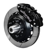Wilwood front Forged Narrow Superlite 6R kit for Chevrolet drum spindle: black caliper and 12.88-inch slotted rotor in assembled view
