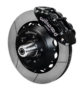 Wilwood front Forged Narrow Superlite 6R kit for Chevrolet drum spindle: black caliper and 14.00-inch slotted rotor in assembled view