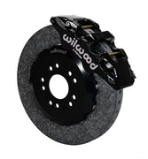 Wilwood Ford Mustang front carbon-ceramic brake kit, black AERO6 calipers beside a dark rotor in assembled view