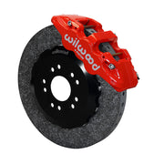 Wilwood Ford Mustang front carbon-ceramic brake kit, red AERO6 calipers beside a dark rotor in assembled view