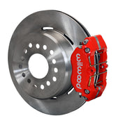 Wilwood Big Ford New Style 2.50-inch-offset rear parking-brake single-side assembly with a red Dynapro Lug Mount caliper beside the plain-face rotor
