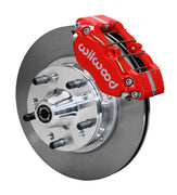 Wilwood GM and Ridetech pin-spindle front single-side assembly showing a red Dynapro dust-boot caliper beside an 11-inch plain-face rotor and protruding wheel studs