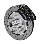 Wilwood GM and Ridetech pin-spindle front single-side assembly showing a black Dynapro dust-boot caliper beside a 12.19-inch drilled-and-slotted rotor and protruding wheel studs