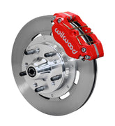 Wilwood GM and Ridetech pin-spindle front single-side assembly showing a red Dynapro dust-boot caliper beside a 12.19-inch plain-face rotor and protruding wheel studs