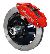 Wilwood TCI IFS front single-side assembly showing a red Superlite 6R caliper beside a 12.88-inch slotted rotor ring and protruding wheel studs