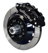 Wilwood TCI IFS front single-side assembly showing a black Superlite 6R caliper beside a 14-inch slotted rotor ring and protruding wheel studs