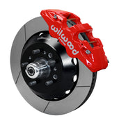 Wilwood TCI IFS front single-side assembly with a red Aero6 caliper beside the slotted rotor ring and protruding wheel studs