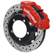 Wilwood Bronco Dana 30/44 drum-spindle front single-side assembly showing a red Superlite 6R caliper beside a 12.88-inch drilled-and-slotted rotor