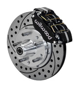 Wilwood Ford and Mercury spindle front single-side assembly showing a black Dynapro dust-boot caliper beside an 11-inch drilled-and-slotted rotor and protruding wheel studs