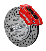 Wilwood Ford and Mercury spindle front single-side assembly showing a red Dynapro dust-boot caliper beside an 11-inch drilled-and-slotted rotor and protruding wheel studs