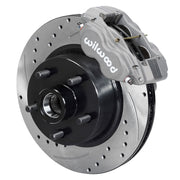Wilwood Ford/Mercury front Dynalite-M brake kit assembly example, showing an anodized caliper positioned over the drilled and slotted rotor/hub