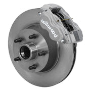 Wilwood later Ford/Mercury front Dynalite-M brake kit assembly example, showing an anodized caliper positioned over the plain-face rotor/hub