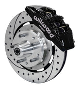 Wilwood AMC front Dynapro 6 brake kit assembly example, showing a black caliper, drilled and slotted rotor and wheel hub