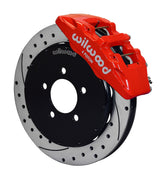 Wilwood Mazda 3 front Dynapro 6 brake kit assembly example, showing a red caliper positioned over the drilled and slotted rotor and mounting hat