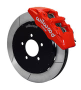 Wilwood Mazda 3 front Dynapro 6 brake kit assembly example, showing a red caliper positioned over the slotted rotor and mounting hat