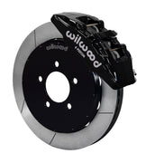 Wilwood Mazda 3 front Dynapro 6 brake kit assembly example, showing a black caliper positioned over the slotted rotor and mounting hat