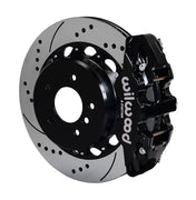 Wilwood BMW rear AERO4 brake kit assembly example, showing a black caliper positioned over the drilled and slotted rotor and mounting hat