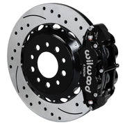 Wilwood Morrison IRS rear Superlite brake kit assembly example, showing a black caliper positioned over the drilled and slotted rotor and mounting hat