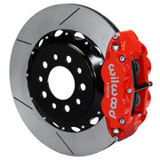 Wilwood Morrison IRS rear Superlite brake kit assembly example, showing a red caliper positioned over the slotted rotor and mounting hat