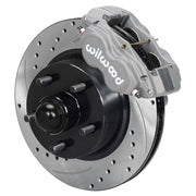 Wilwood full-size front Dynalite-M brake kit assembly example, showing an anodized caliper positioned over the drilled and slotted rotor/hub