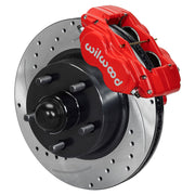Wilwood full-size front Dynalite-M brake kit assembly example, showing a red caliper positioned over the drilled and slotted rotor/hub