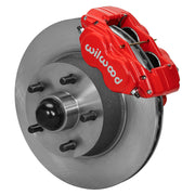 Wilwood full-size front Dynalite-M brake kit assembly example, showing a red caliper positioned over the plain-face rotor/hub