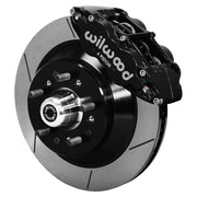 Wilwood full-size front Superlite rotor-hat brake kit assembly example, showing a black caliper positioned over the slotted rotor and mounting hat