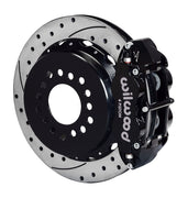 Wilwood staggered Big Ford New Style rear brake kit assembly example, showing a black caliper positioned over the drilled and slotted rotor and mounting hat