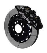 Wilwood Mustang BMR front AERO6 brake kit assembly example, showing a black caliper positioned over the slotted rotor and mounting hat