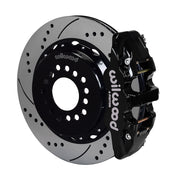 Wilwood Mustang BMR rear AERO4 parking-brake kit assembly example, showing a black caliper positioned over the drilled and slotted rotor and mounting hat
