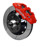 Wilwood Chevy/GMC drop-spindle front AERO6 brake kit assembly example, showing a red caliper positioned over the slotted rotor and mounting hat