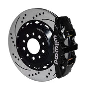Wilwood Corvette C7 rear AERO4 brake kit assembly example, showing a black caliper positioned over the drilled and slotted rotor and mounting hat