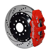 Wilwood Corvette C7 rear AERO4 brake kit assembly example, showing a red caliper positioned over the drilled and slotted rotor and mounting hat