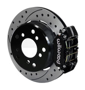 Wilwood Bronco 2.00-inch-offset rear Dynapro brake kit assembly example, showing a black caliper positioned over the drilled and slotted rotor and mounting hat