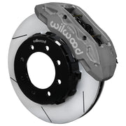 Wilwood Super Duty 4WD front TX6R brake kit assembly example, showing an anodized caliper positioned over the slotted rotor and mounting hat