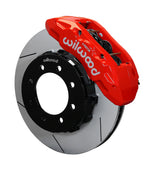 Wilwood Super Duty 4WD front TX6R brake kit assembly example, showing a red caliper positioned over the slotted rotor and mounting hat