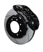 Wilwood Super Duty 4WD front TX6R brake kit assembly example, showing a black caliper positioned over the slotted rotor and mounting hat