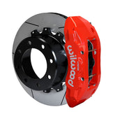 Wilwood Super Duty 4WD rear TX6R brake kit assembly example, showing a red caliper positioned over the slotted rotor and mounting hat