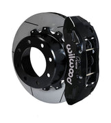 Wilwood Super Duty 4WD rear TX6R brake kit assembly example, showing a black caliper positioned over the slotted rotor and mounting hat