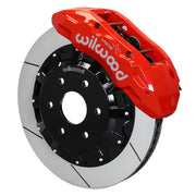 Wilwood TX6R caliper shown in a warm red-orange finish over an assembled slotted rotor and black six-lug hat
