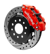 Wilwood red Superlite 6R caliper over an assembled 12.88-inch drilled-and-slotted rotor and separate mounting hat
