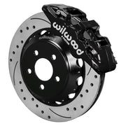 Wilwood black AERO6 front caliper with an assembled 15-inch drilled-and-slotted rotor and black mounting hat, shown for S550 Mustang or specified Ridetech hub spindles