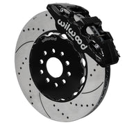 Wilwood black AERO6 front caliper with an assembled 15-inch drilled-and-slotted rotor and black mounting hat, shown for C5/C6 Corvette and XLR