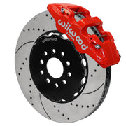 Wilwood red AERO6 front caliper with an assembled 15-inch drilled-and-slotted rotor and black mounting hat, shown for C5/C6 Corvette and XLR