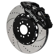 Wilwood black AERO6 front caliper with an assembled 15-inch drilled-and-slotted rotor and black mounting hat, shown for C7 Corvette