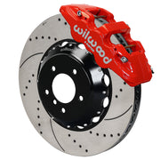 Wilwood red AERO6 front caliper with an assembled 15-inch drilled-and-slotted rotor and black mounting hat, shown for listed BMW 1 and 3 Series applications